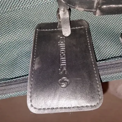 SAMSONITE HARD SIDED SUITCASE ON 4 WHEELS AND A SAMSONITE GARMENT BAG