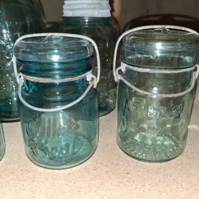 AQUA BLUE CANNING JARS WITH ZINC AND WIRE BALE LIDS