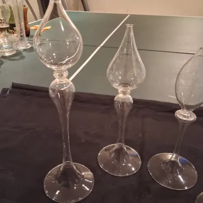 GLASS FLOATS IN A RUFFLED GLASS BOWL PLUS OIL CANDLE LAMPS