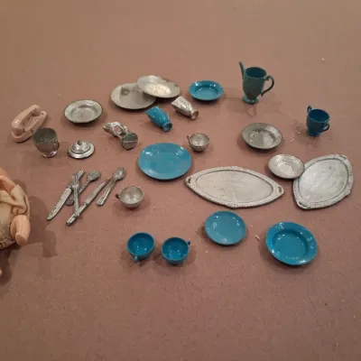 MOSTLY METAL MINIATURE DISHES AND A SMALL BABY DOLL