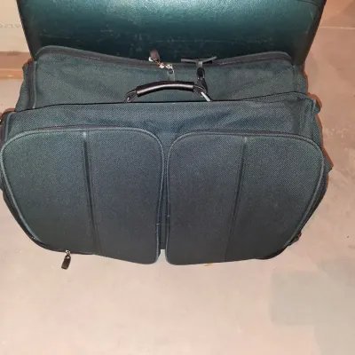 SAMSONITE HARD SIDED SUITCASE ON 4 WHEELS AND A SAMSONITE GARMENT BAG