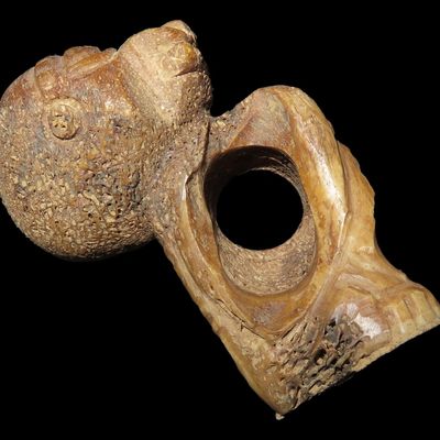 Sale Photo Thumbnail #347: 3" Pre-Columbian Bone Effigy of a Deity Carrying a Human, Peru