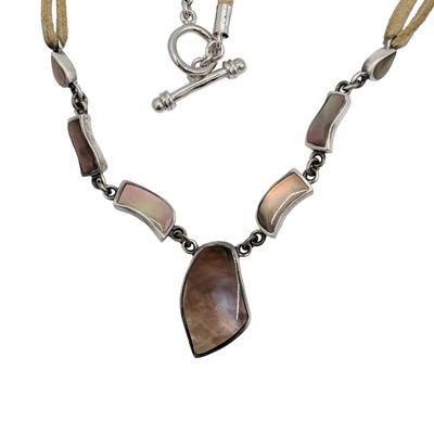Sale Photo Thumbnail #428: Signed Sterling Silver Beige Cord Abalone Pendant Necklace