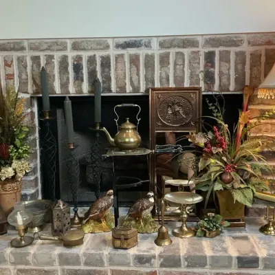 Fireplace Décor with Table Lamp, Floral Arrangements and Brass Accessories