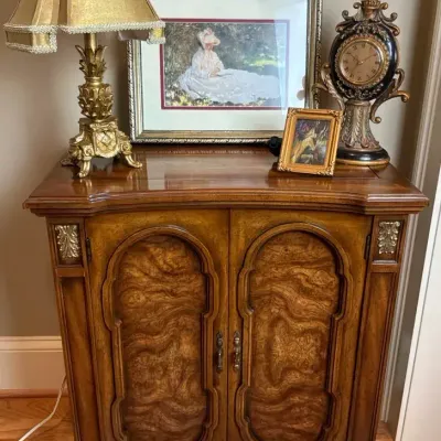 Wood Accent Cabinet with Lamp, Clock and Framed Artwork