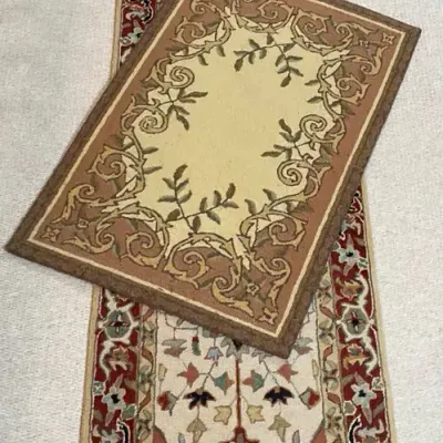 Two Floral Pattern Area Rugs