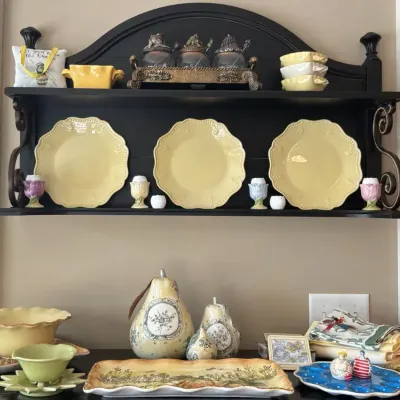 Black Wall Shelf with Ceramic Tableware and Kitchen Accessories
