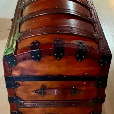Sale Photo Thumbnail #102: Circa 1880's.
Initials SCW etched in side leather handles.
No key.
Measures 28 inches high, 36 inches wide and 19 inches deep.