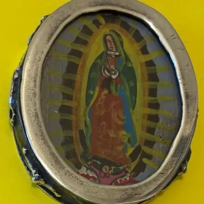 Sale Photo Thumbnail #180: Our Lady Of Guadalupe with different image on other side.
Pendant measures 2 inches high and 2 inches wide.
Chain measures 22 inches long.