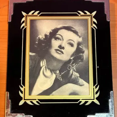 Sale Photo Thumbnail #172: Myrna Loy photo measures 6 inches high and 5 inches wide (cardboard stand on back of photo is detached).
Don Ameche photo measures 8 inches high and 5 1/2 inches wide.
