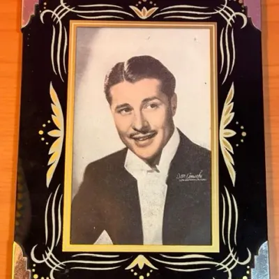 Sale Photo Thumbnail #171: Myrna Loy photo measures 6 inches high and 5 inches wide (cardboard stand on back of photo is detached).
Don Ameche photo measures 8 inches high and 5 1/2 inches wide.
