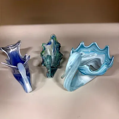 A Trio Of Blue-Toned Hand-Blown Glass Swans
