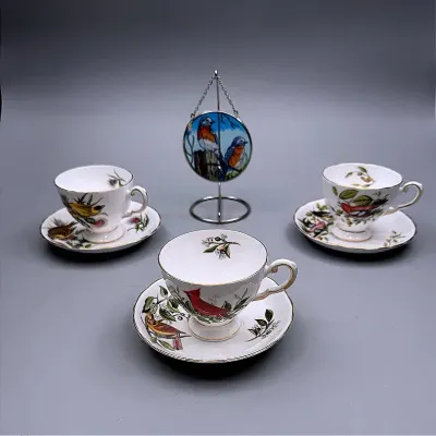 Audubon Birds Bone China Teacup & Saucer Sets And An AMIA Of Denver Handpainted Bird Suncatcher
