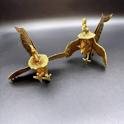A Pair Of Brass Fighting Roosters