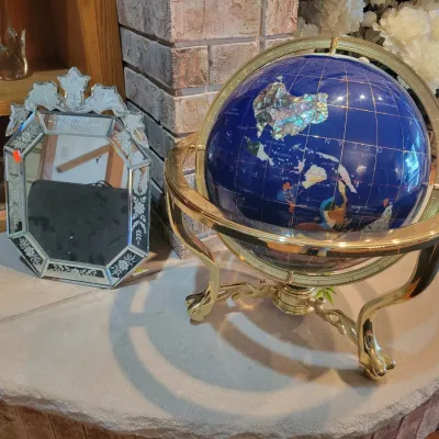 Venetian style mirror and decorative world globe 