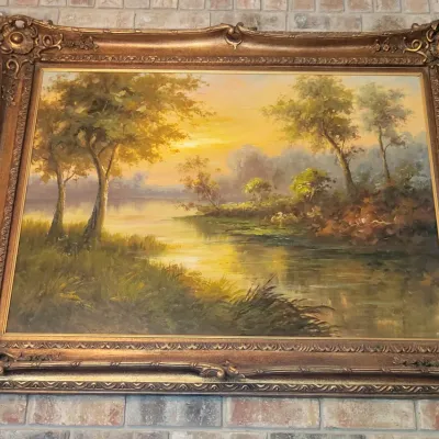 Landscape oil painting in large gold frame