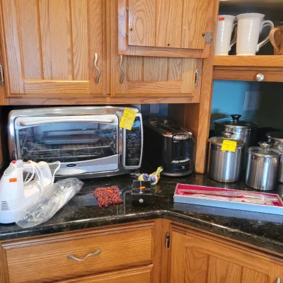 Here comes the kitchen: 
Oster toaster oven and metal canister set 