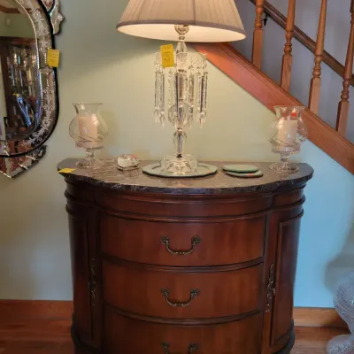 Stone top Demilune cabinet and glass accents 