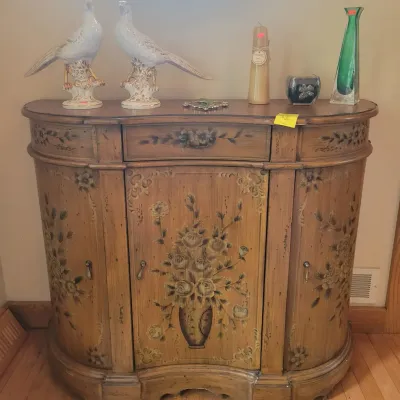 Painted demilune accent cabinet  and pair of ceramic pheasants 