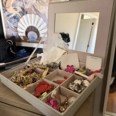 Costume jewelry lot, statement necklaces and earrings, mirrored jewelry case