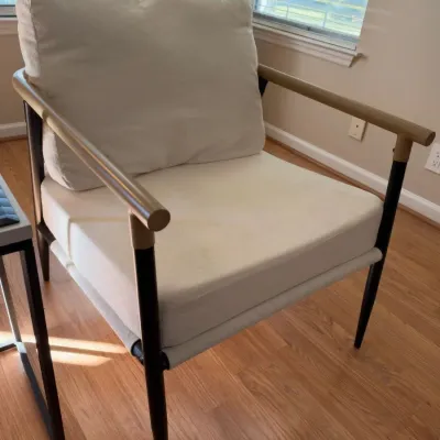Modern cream accent chair, black metal frame, wood arms
