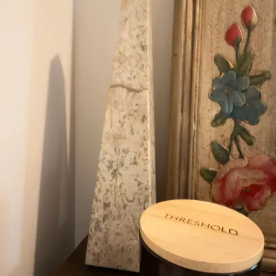 Decorative stone obelisk and Threshold jar candle