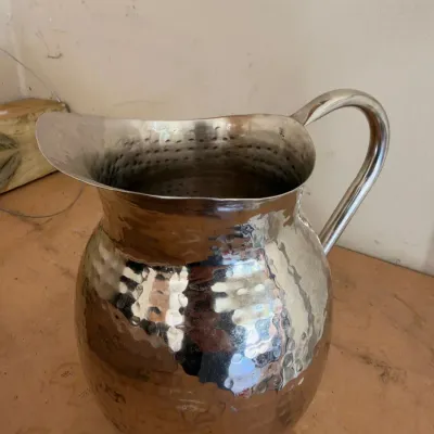 Hammered silver-tone metal water pitcher