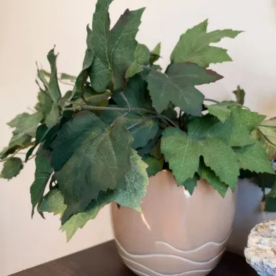 Artificial greenery in blush ceramic planter