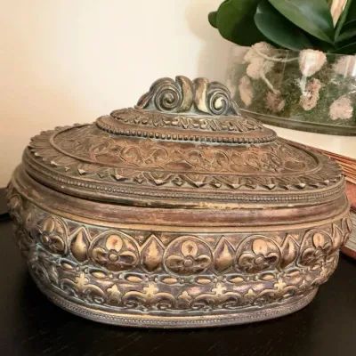 Ornate embossed metal lidded oval box