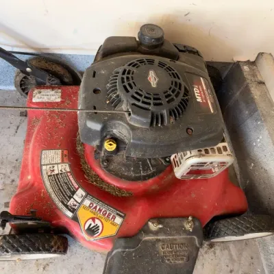 Red gas push lawn mower, engine close-up