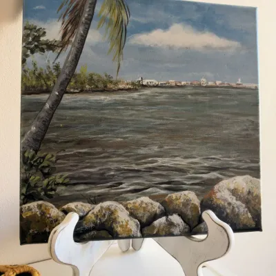 Tropical seascape painting on canvas with white wood easel stand