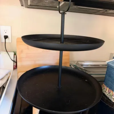 Black metal two-tier serving tray stand