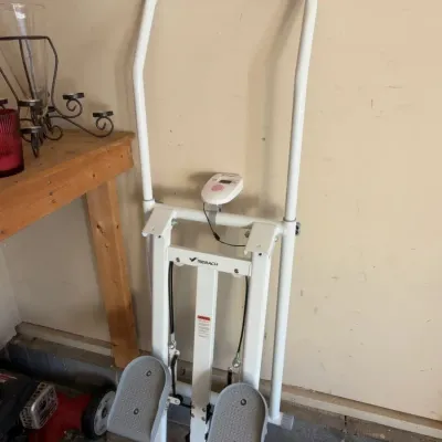Stepper exercise machine with handlebars and digital display