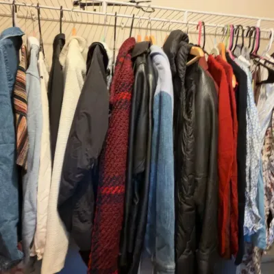 Clothing rack, denim and leather jackets, blouses, coats