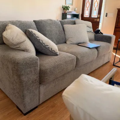 Gray upholstered sofa with throw pillows
