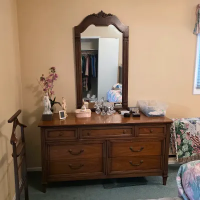 Vintage wood dresser with mirror from the bedroom furnishings bearing a Bullock’s retailer label.