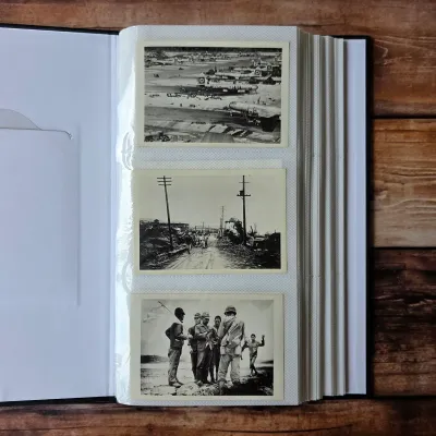 Detail from the 33-photo WWII Pacific archive: military aircraft on an airfield, wartime destruction and servicemen. Album offered intact.
