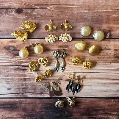 Vintage costume earrings in floral, pearl-style, gold-tone and colorful decorative designs.