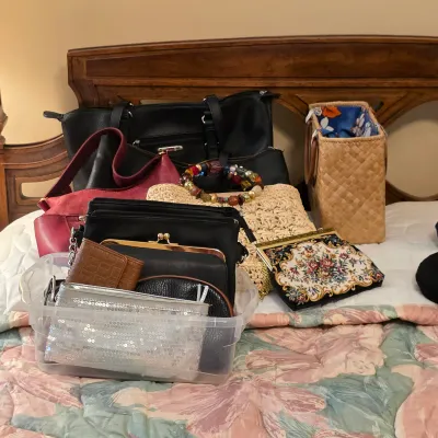 Assorted vintage handbags, evening bags and clutches, including beaded and metallic styles.