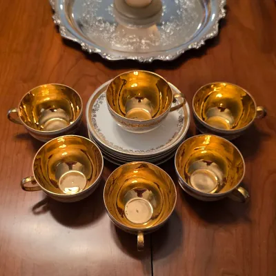 B.T. Co. Antique gold-interior cups and saucers with decorative borders and gold-tone handles. (1891 - 1907)
