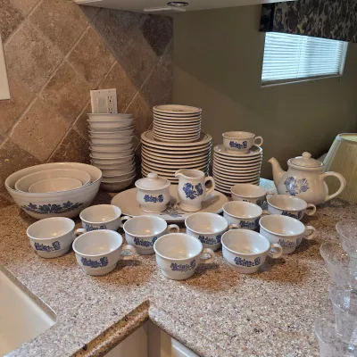 Large vintage stoneware serving ware collection with plates, bowls, cups, and serving pieces. 