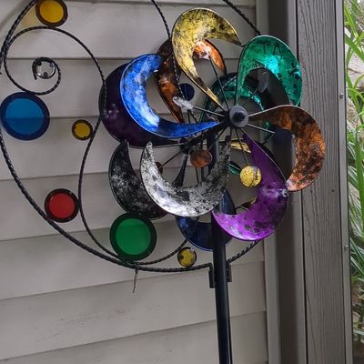 Multi-Colored Kinetic Garden Wind Spinner with Decorative Accents