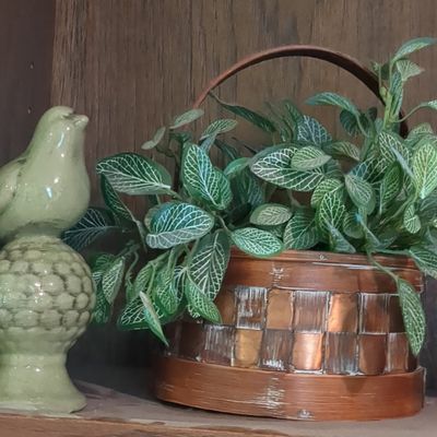 Vintage Ceramic Bird Figurine with Woven Copper Basket Planter containing Fittonia Plant