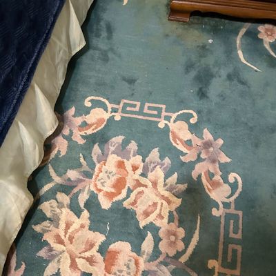 Sale Photo Thumbnail #114: Chinese Art Deco style wool rug featuring a teal field with pink and beige floral motifs and a Greek key border.