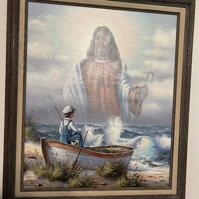 Sale Photo Thumbnail #150: Framed religious art print by Bill Bayer, depicting a young boy in a rowboat looking out at a spectral figure of Jesus over the ocean, housed in a rustic wooden frame.