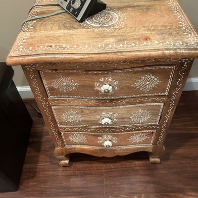 Sale Photo Thumbnail #65: Hand-painted wooden three-drawer nightstand featuring white bohemian-style geometric patterns and ceramic flower knobs.