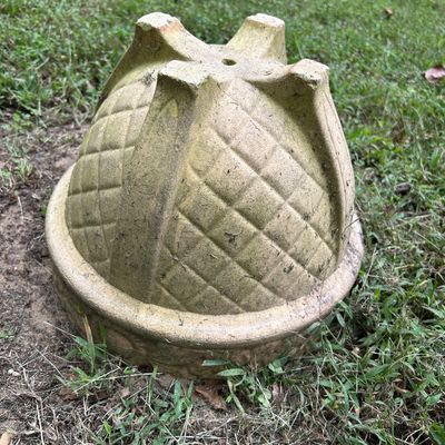 Sale Photo Thumbnail #4: Vintage concrete garden planter with a textured diamond pattern, shown upside down on a grassy lawn.