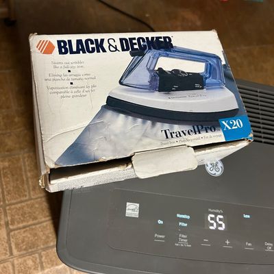 Sale Photo Thumbnail #64: Vintage Black & Decker TravelPro X20 travel iron, in its original cardboard packaging showing some wear.