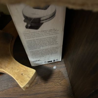 Sale Photo Thumbnail #11: Cuisinart waffle maker in its original box, tucked inside a wooden cabinet shelf next to a wooden cutting board.