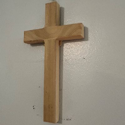 Sale Photo Thumbnail #41: Simple, hand-carved wooden wall cross with a natural finish, showing visible wood grain.